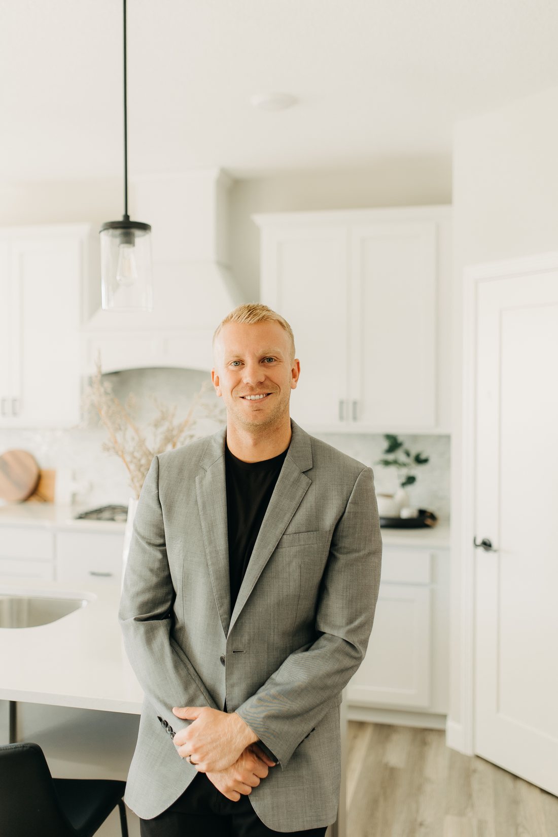 Adam Hippe touring a home with buyers in the northwest Twin Cities metro